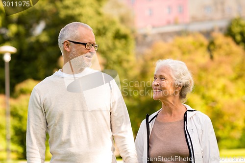 Image of senior couple in city park