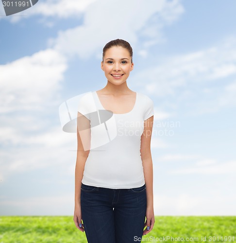 Image of smiling young woman in blank white t-shirt