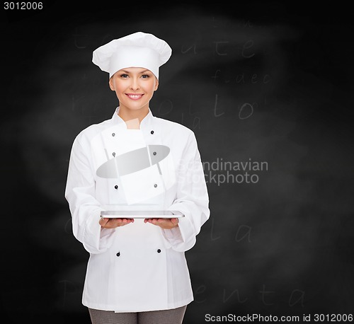 Image of smiling female chef with tablet pc computer