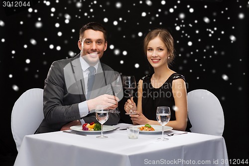 Image of smiling couple at restaurant