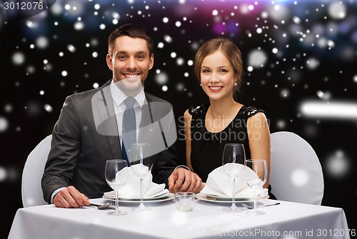 Image of smiling couple at restaurant