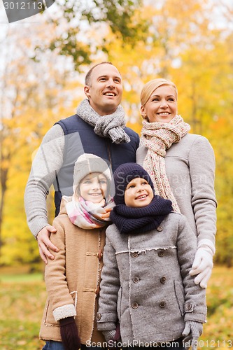 Image of happy family in autumn park
