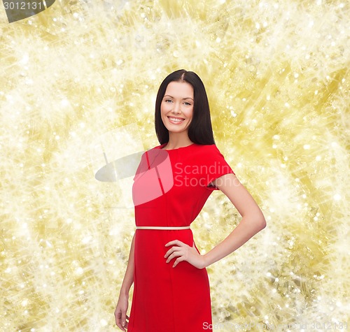Image of smiling woman in red dress