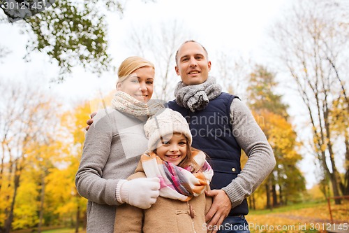 Image of happy family in autumn park