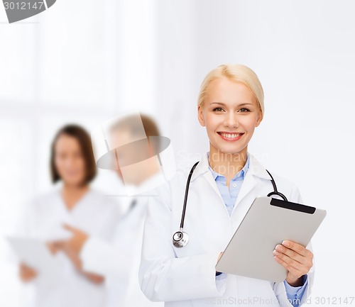 Image of female doctor with stethoscope and tablet pc