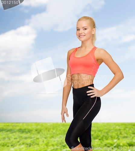 Image of beautiful athletic woman in sportswear