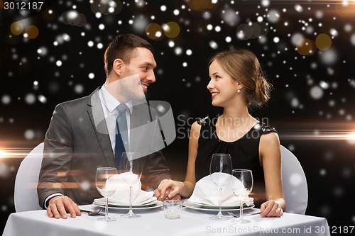 Image of smiling couple at restaurant