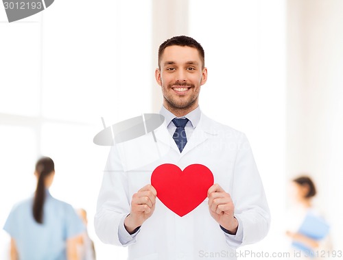 Image of smiling male doctor with red heart