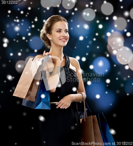 Image of smiling woman with shopping bags