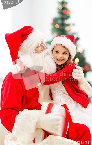 Image of smiling little girl with santa claus