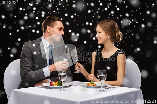 Image of smiling couple at restaurant