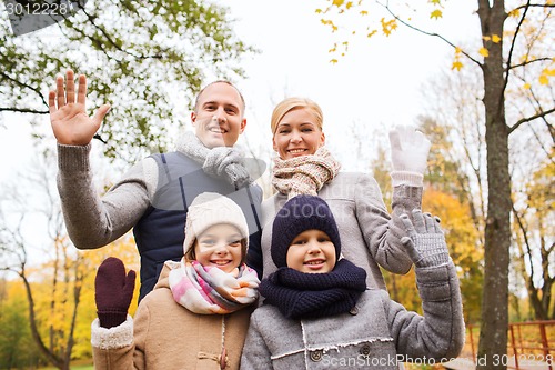 Image of happy family in autumn park