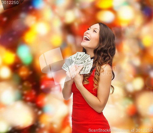 Image of woman in red dress with us dollar money