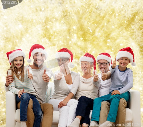 Image of happy family sitting on couch