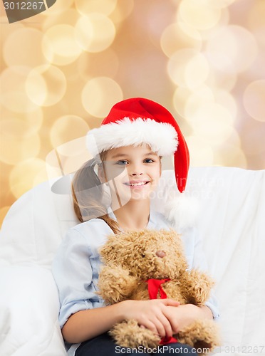 Image of smiling little girl with teddy bear