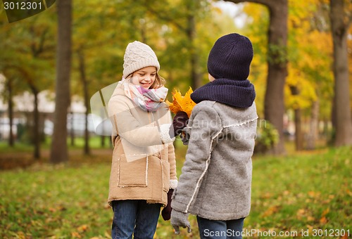 Image of smiling children in autumn park