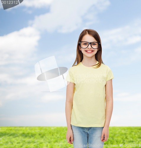 Image of smiling cute little girl in black eyeglasses