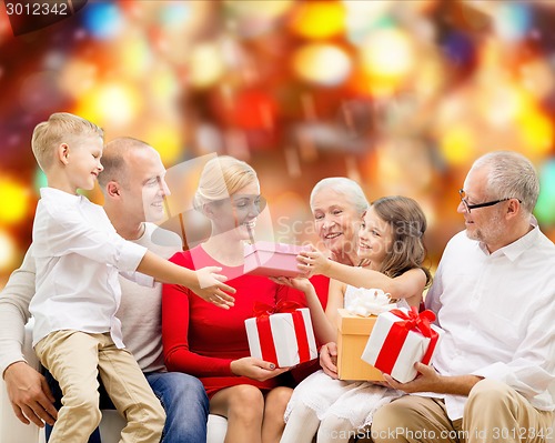 Image of smiling family with gifts