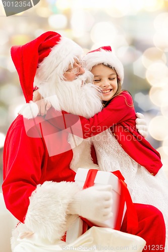 Image of smiling little girl with santa claus