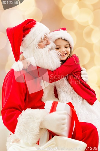 Image of smiling little girl with santa claus