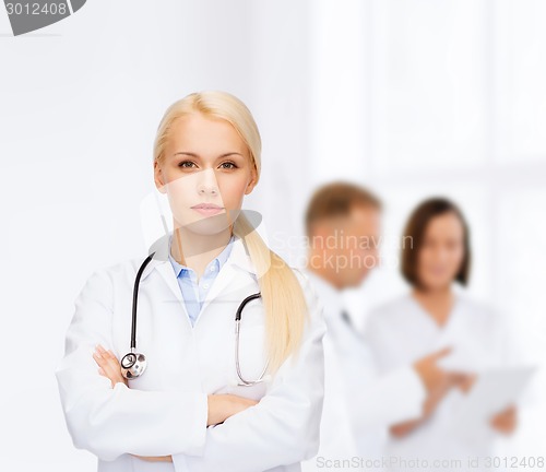 Image of serious female doctor with stethoscope