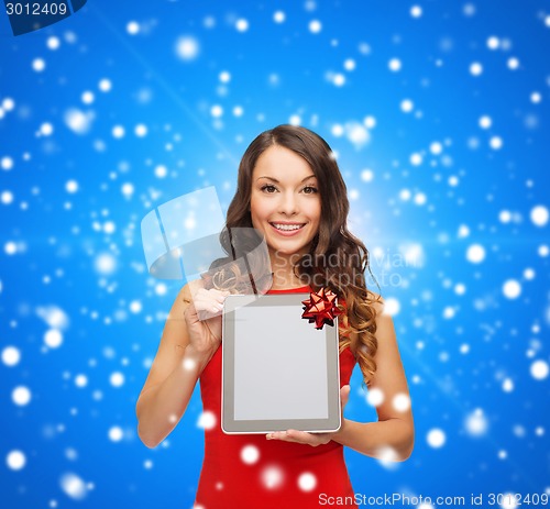 Image of smiling woman with tablet pc