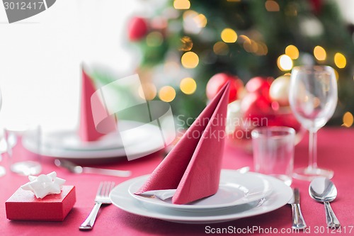 Image of room with christmas tree and decorated table