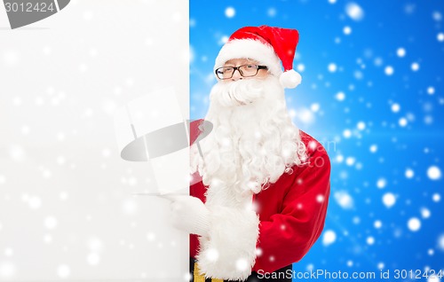 Image of man in costume of santa claus with billboard