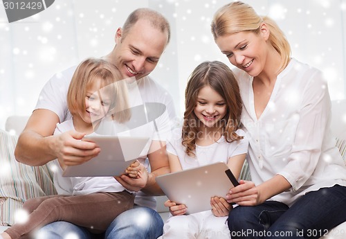 Image of happy family with tablet pc computers