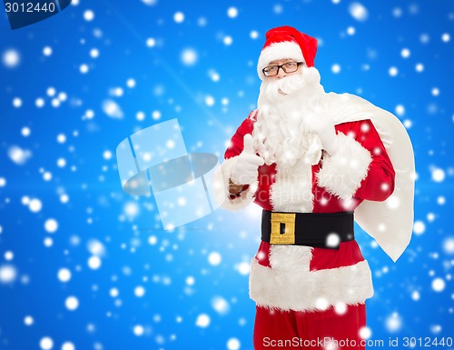 Image of man in costume of santa claus with bag