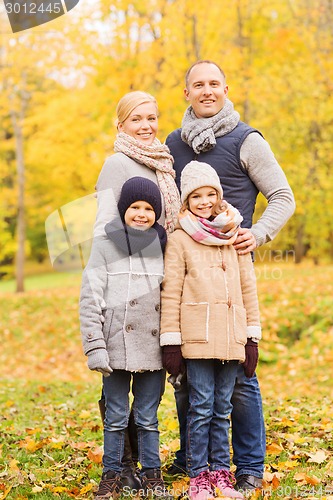 Image of happy family in autumn park