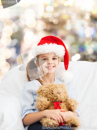 Image of smiling little girl with teddy bear