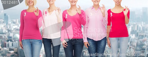 Image of close up of women with cancer awareness ribbons