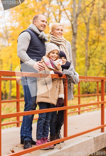 Image of happy family in autumn park