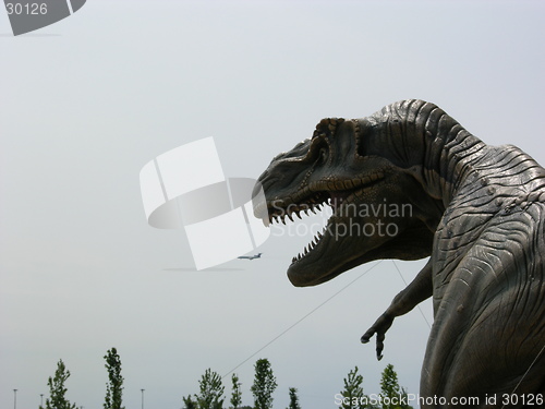 Image of Dinosaur eating an airplane