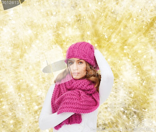 Image of smiling young woman in winter clothes