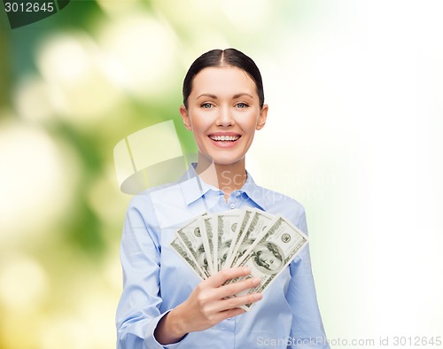 Image of businesswoman with dollar cash money