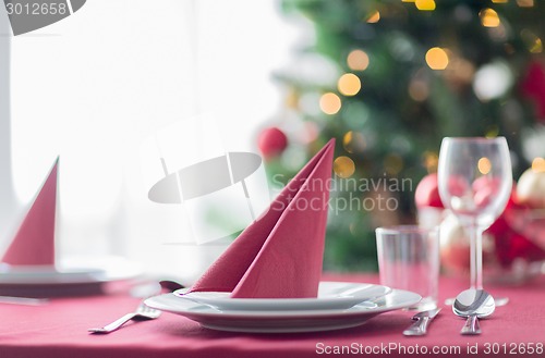 Image of room with christmas tree and decorated table