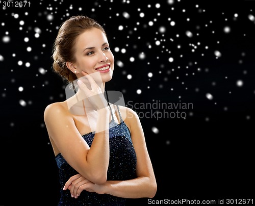 Image of smiling woman in evening dress