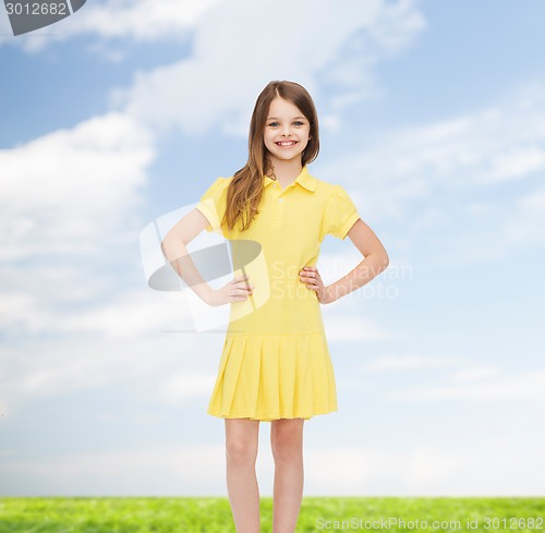 Image of smiling little girl in yellow dress