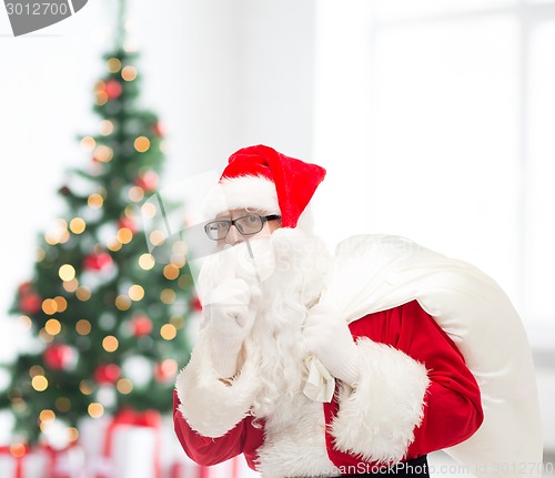 Image of man in costume of santa claus with bag