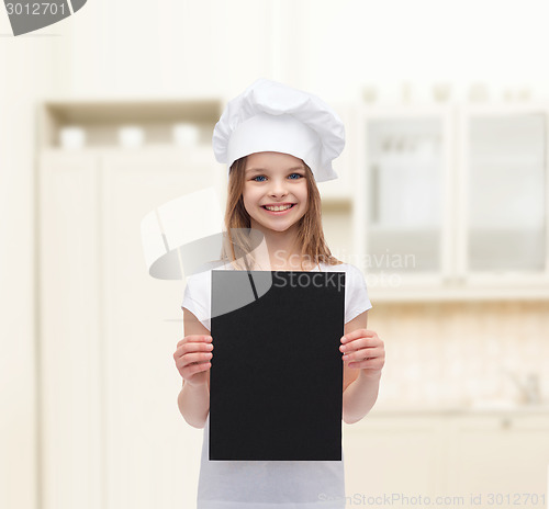 Image of little cook or baker with blank black paper