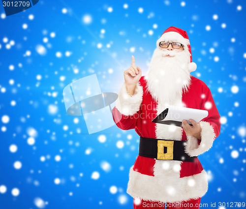 Image of man in costume of santa claus with notepad