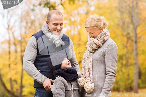 Image of happy family in autumn park