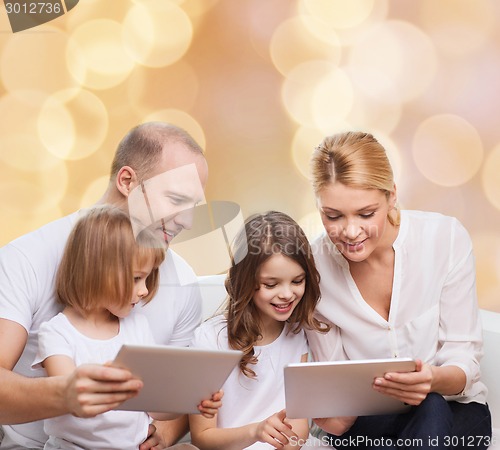 Image of happy family with tablet pc computers