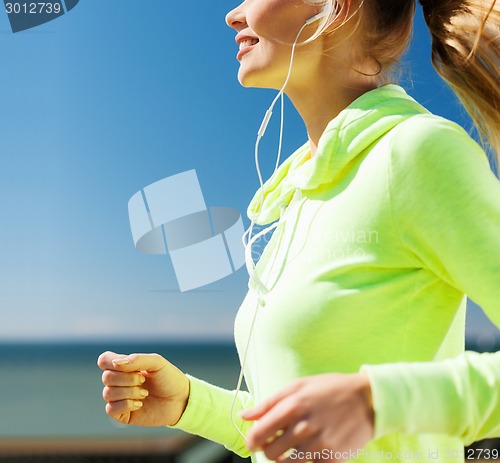 Image of woman running outdoors