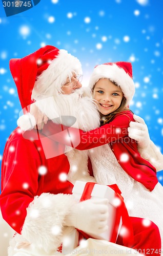 Image of smiling little girl with santa claus