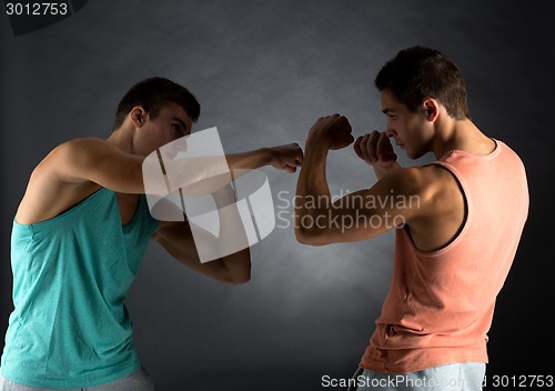 Image of young men wrestling