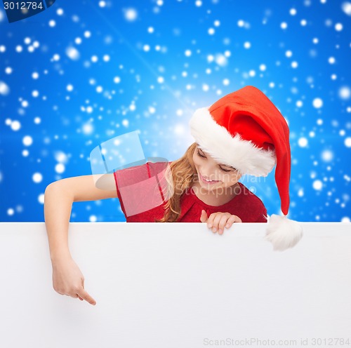 Image of girl in santa helper hat with blank white board