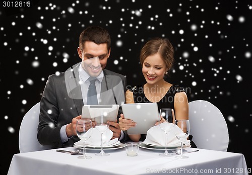 Image of smiling couple at restaurant